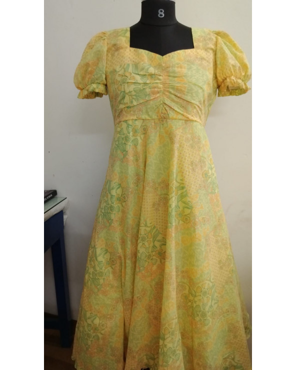 Yellow floral frock with designer yoke and short balloon sleeves