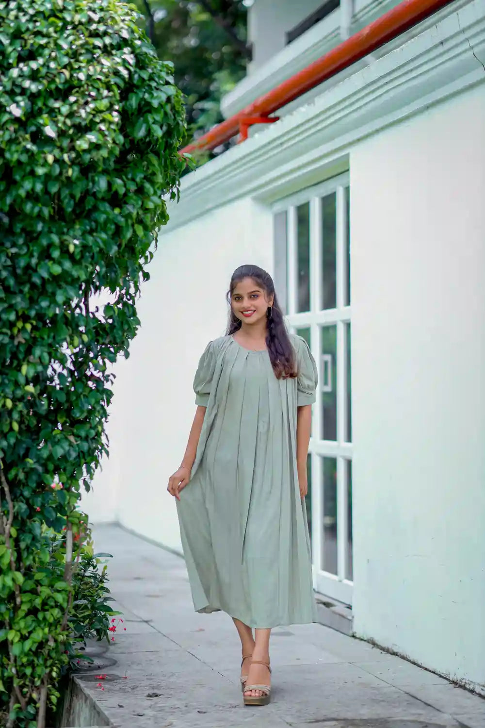 Pastel olive green pleated dress