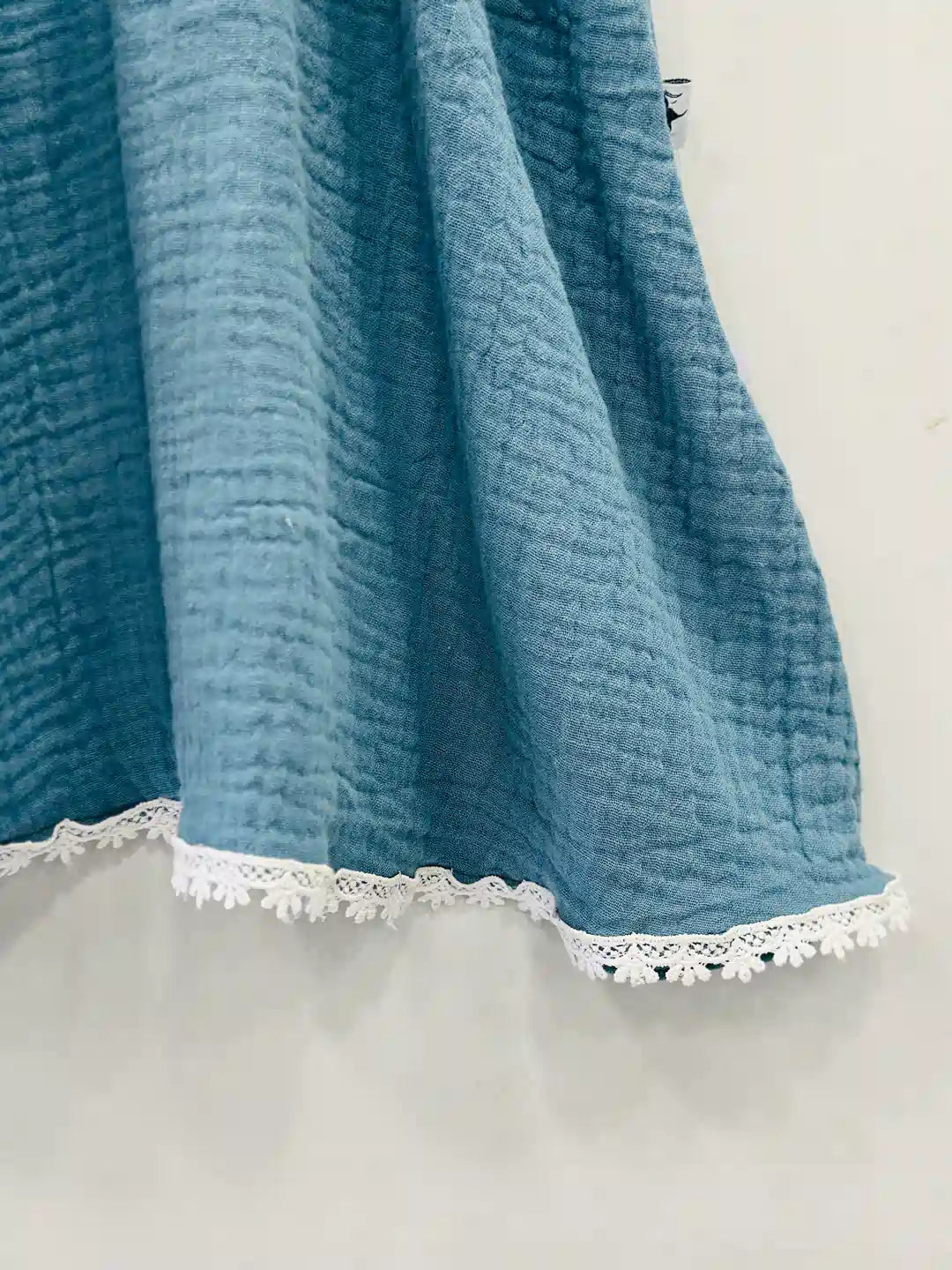 baby-dress-in-muslin-fabric-with-lace-detailing