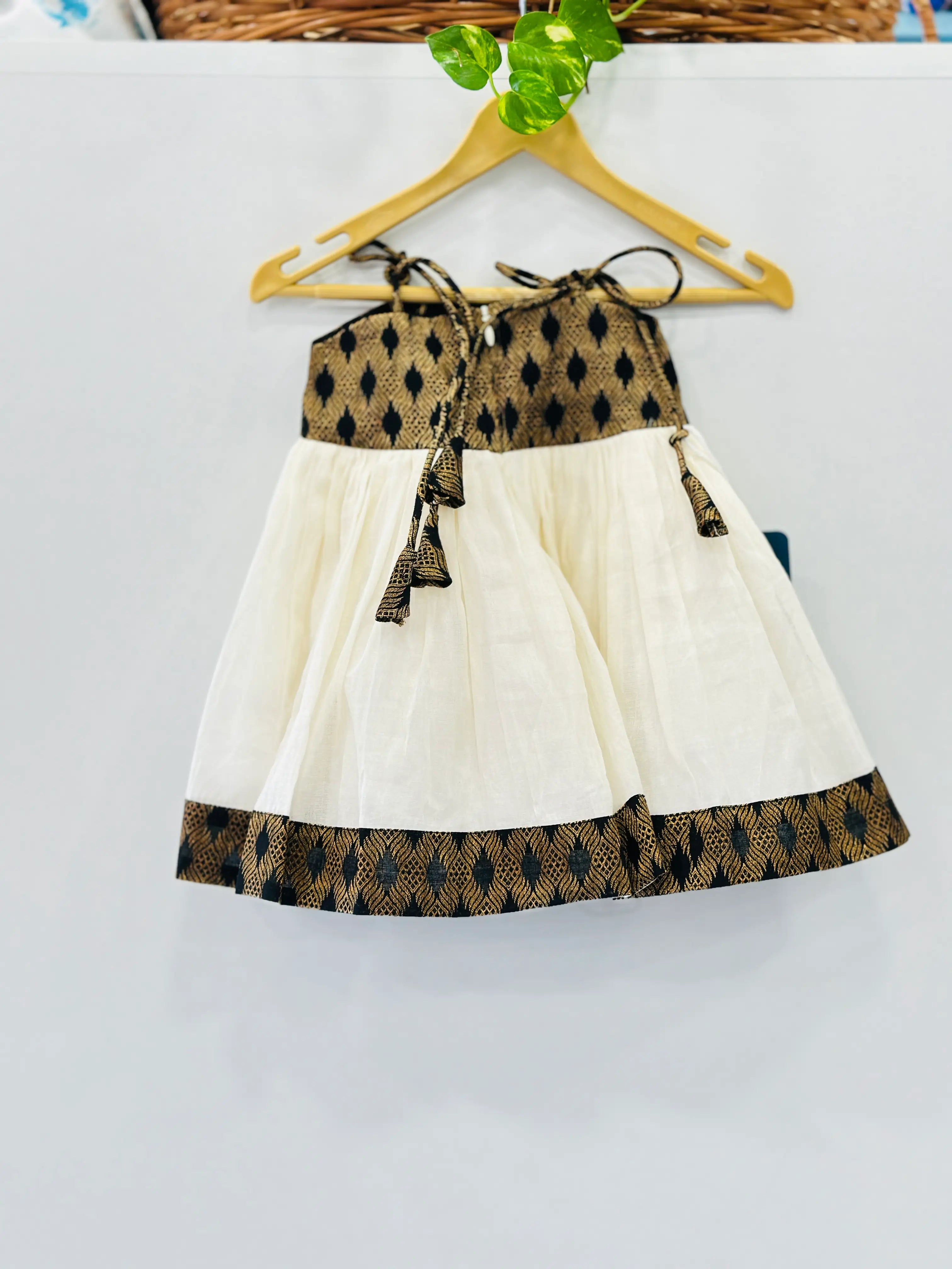 kerala-kasavu-frock-for-girls-knotted-neck-umbrella-cut-indian-traditional-dress