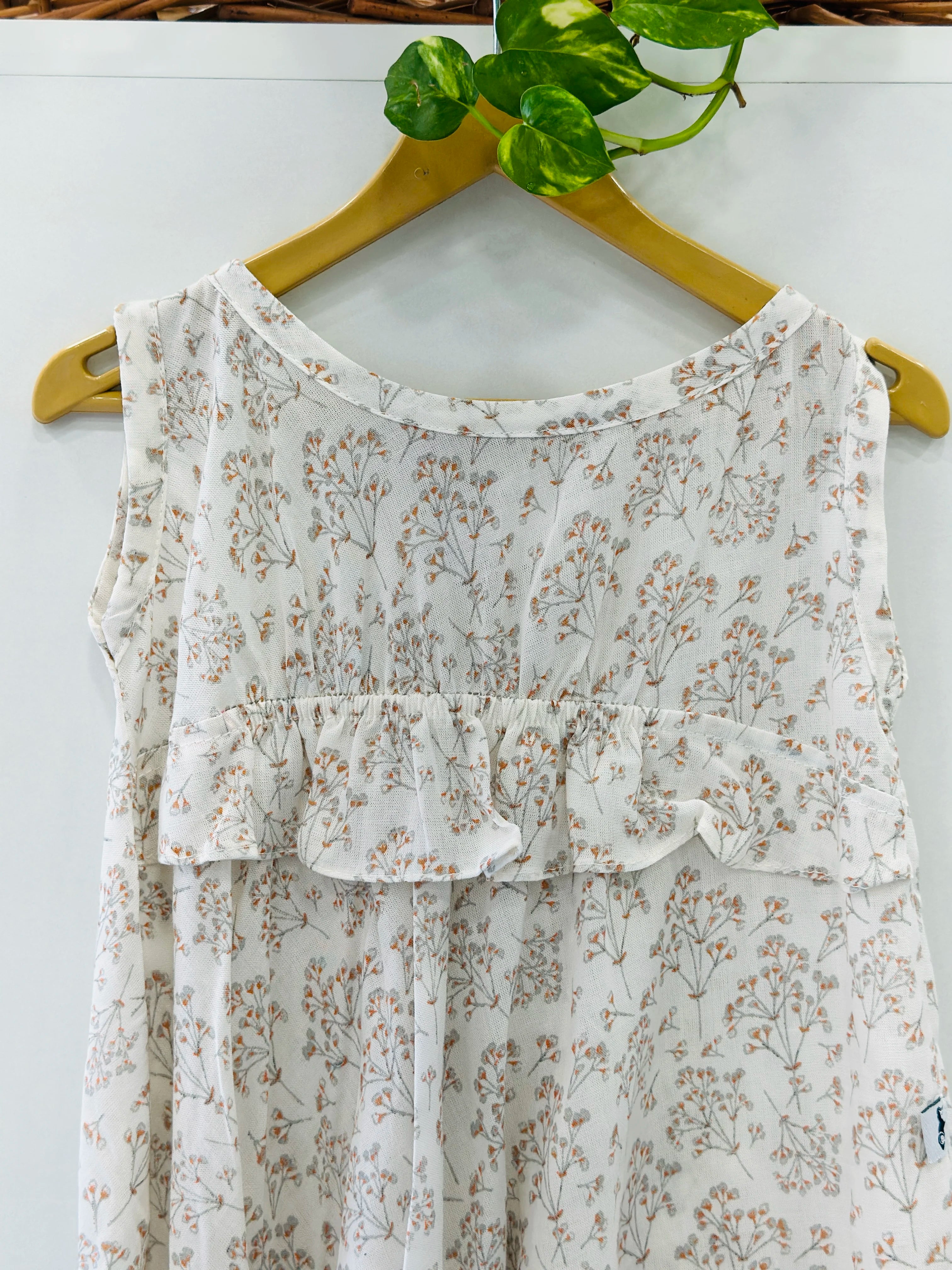 floral-printed-cotton-frock-for-kids-white-a-line-dress-with-round-neck-and-multi-coloured-embroidery