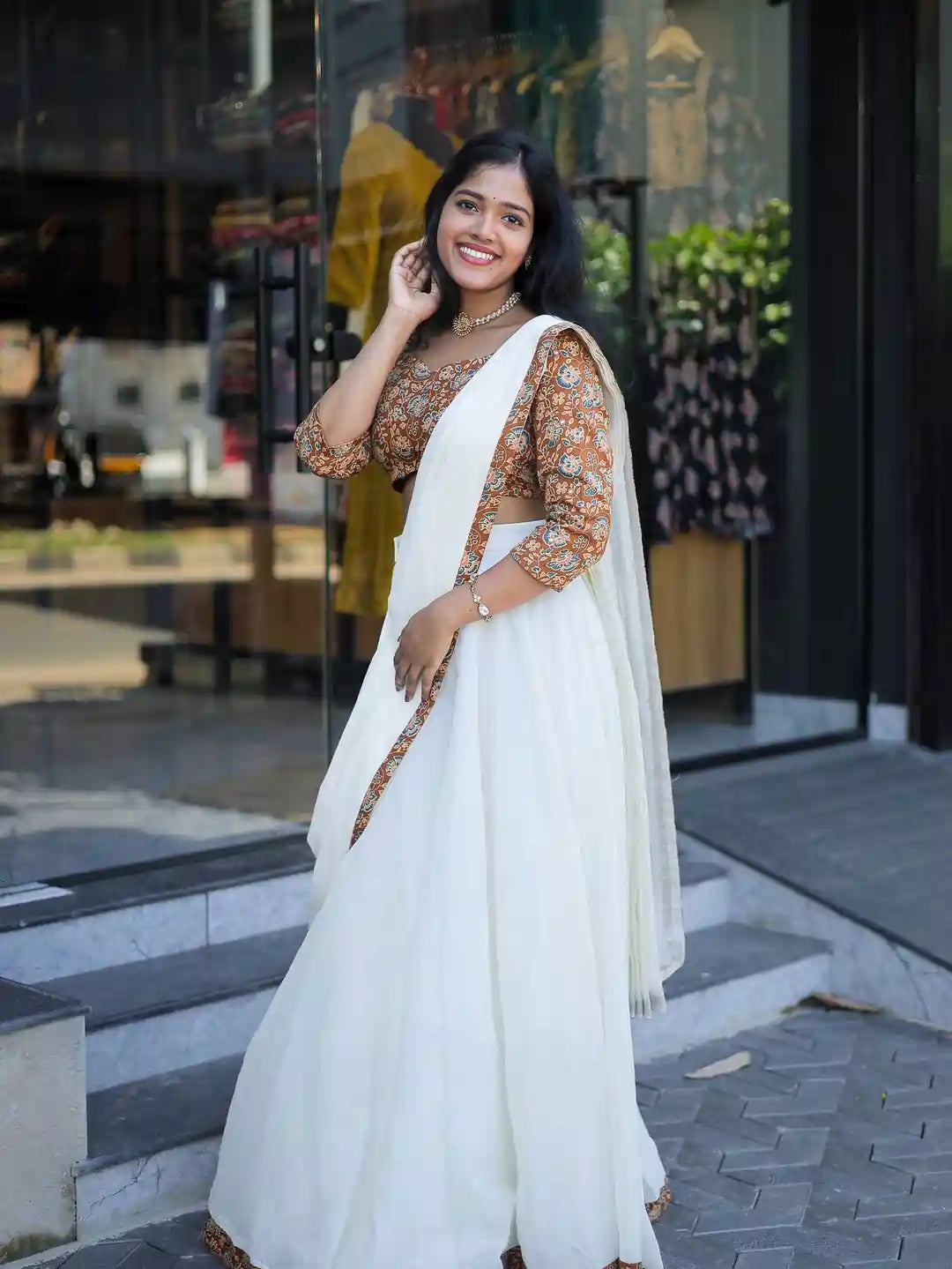 women-in-white-dhavani-set-with-mustard-yellow-printed-blouse